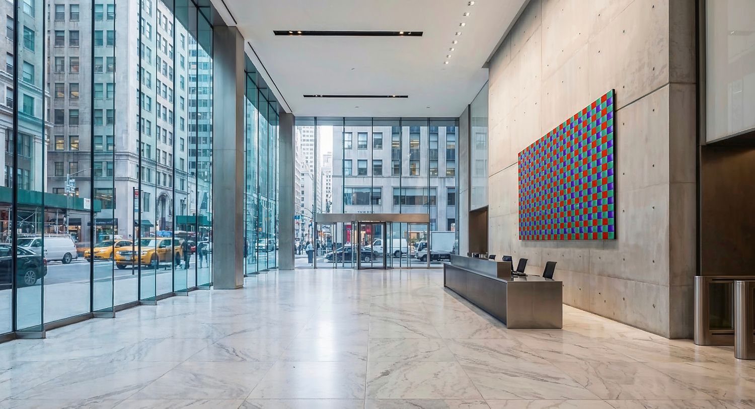 Photorealistic 3D rendering of modern luxury corporate lobby with large colorful grid artwork on concrete wall, stainless steel reception desk, polished marble floor and floor-to-ceiling glass windows showing busy city street with yellow taxis