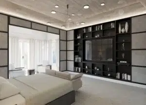 A living room with built-in black shelving, a sofa, and large windows. This Interior Rendering was done for Rubin Residence