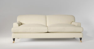 Elegant cream-colored sofa with legs