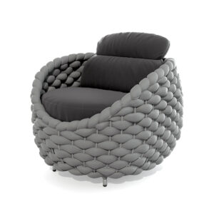 The image depicts a modern, uniquely designed armchair with a distinctive woven texture. The chair features a circular, cushioned seat and backrest, both upholstered in a dark fabric, possibly leather or a similar material. The most striking feature is the armrests and the base, which are made of a series of interwoven, rounded elements that give the chair a sculptural and organic appearance. The base of the chair is supported by four small, sleek legs. The overall design is contemporary and artistic, blending functionality with a bold aesthetic.