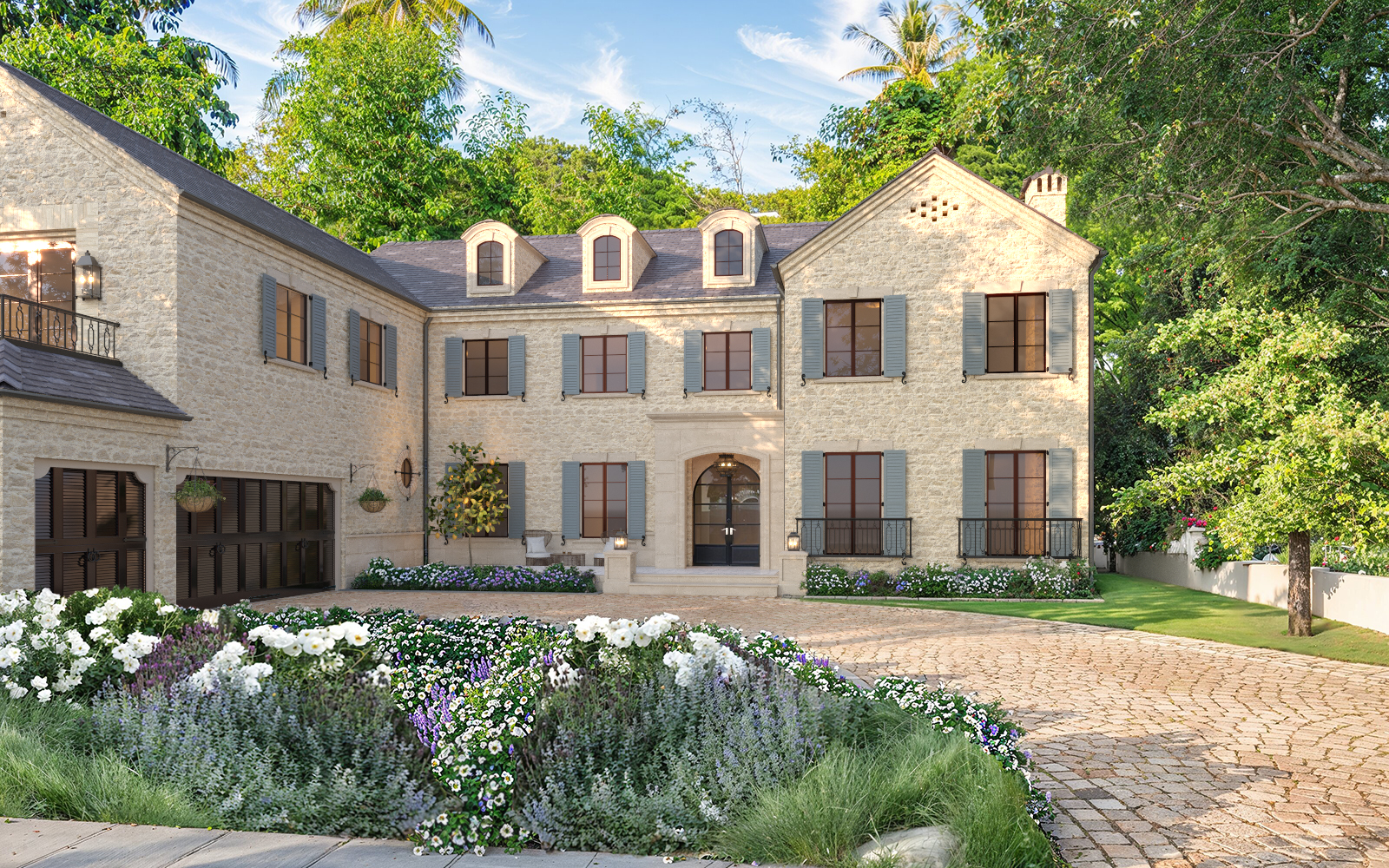 Photorealistic 3D rendering of luxurious two-story stone Raddon Residence Option A with light beige stone facade, gray shutters, dark slate roof, elegant arched entrance, cobblestone driveway and vibrant colorful flower beds