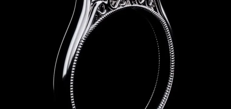 3D jewelry rendering of a white metal ring with intricate detailing on a black background, highlighting luxury design.