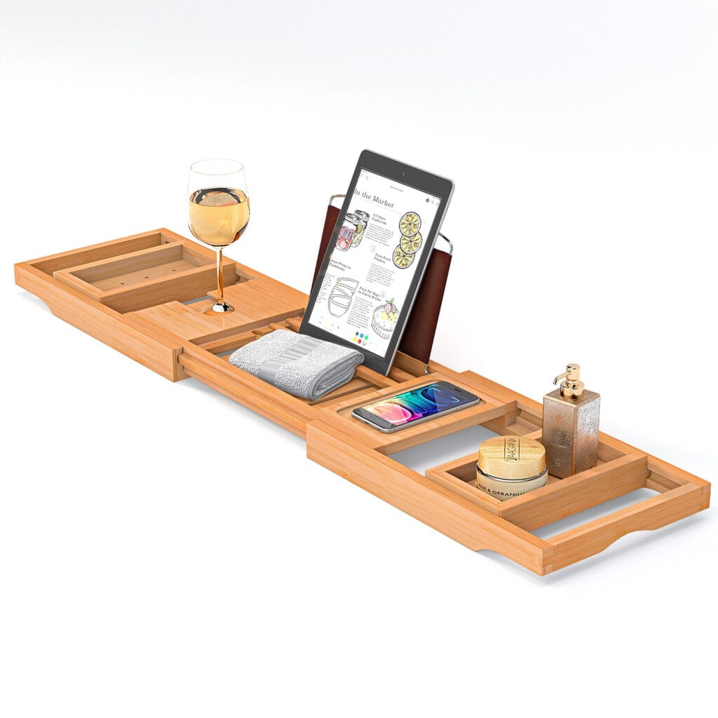 A wooden tray with a tablet and a glass placed on it, designed for use in a bathtub with spaces for a smartphone and tablet