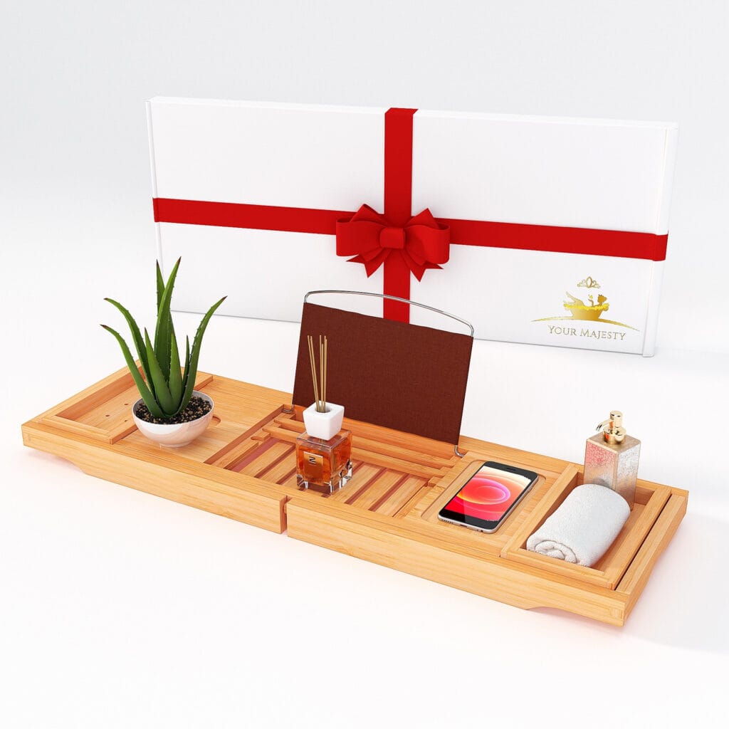 A wooden tray with a tablet designed for use in a bathtub with spaces for decorative tree, a face towel and smartphone