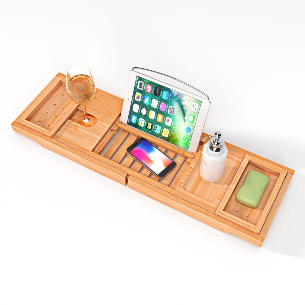 A wooden tray with a tablet designed for use in a bathtub with spaces for a soap, smartphone, tablet